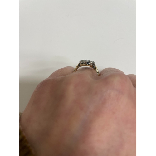 29 - An early-mid 20th century sapphire, diamond and emerald cluster ring, designed as a central round mi... 