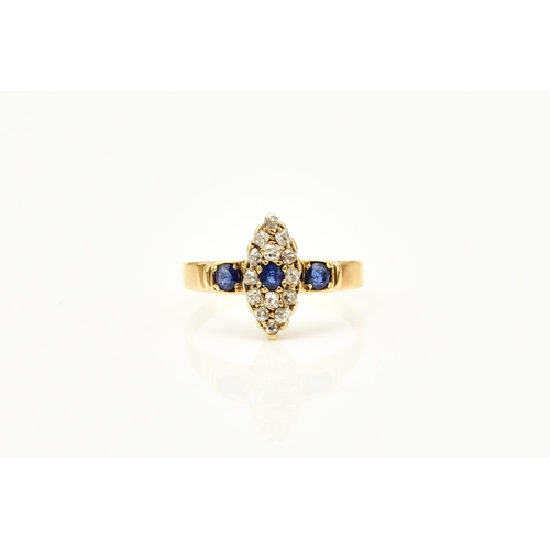 30 - An 18ct gold Edwardian sapphire and diamond ring, designed as a central round cut sapphire claw set ... 
