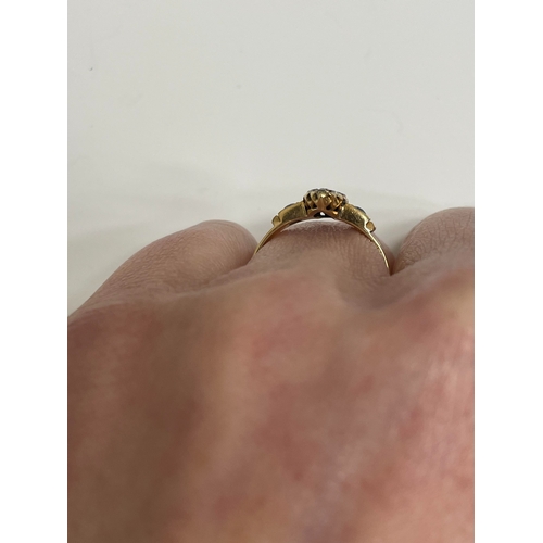 30 - An 18ct gold Edwardian sapphire and diamond ring, designed as a central round cut sapphire claw set ... 