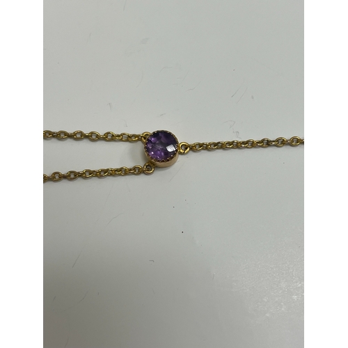 31 - An amethyst pendant necklace, designed as a heart shaped faceted amethyst within a cannetille scroll... 