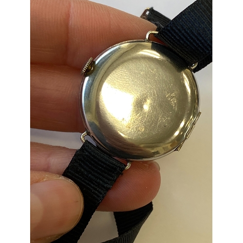 34 - An Art Deco diamond set cocktail watch, the circular silvered dial with black Roman numerals mounted... 