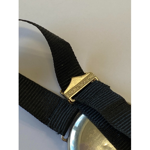 34 - An Art Deco diamond set cocktail watch, the circular silvered dial with black Roman numerals mounted... 