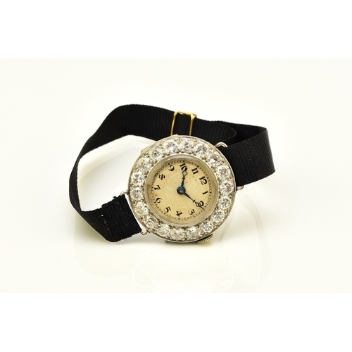 34 - An Art Deco diamond set cocktail watch, the circular silvered dial with black Roman numerals mounted... 