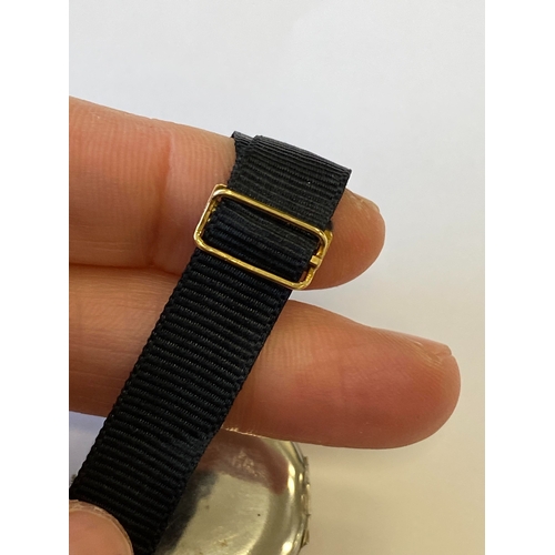 34 - An Art Deco diamond set cocktail watch, the circular silvered dial with black Roman numerals mounted... 