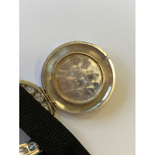 34 - An Art Deco diamond set cocktail watch, the circular silvered dial with black Roman numerals mounted... 