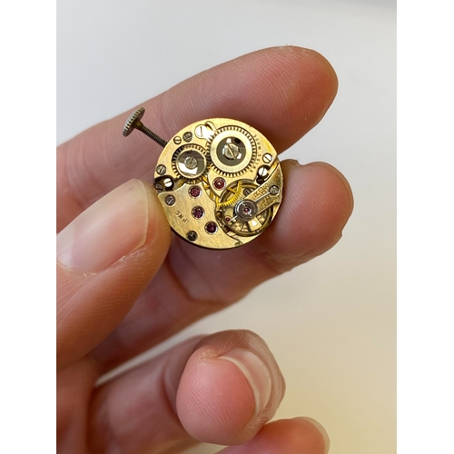 34 - An Art Deco diamond set cocktail watch, the circular silvered dial with black Roman numerals mounted... 