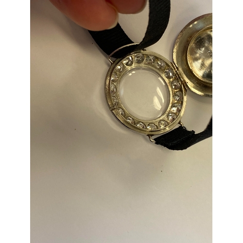 34 - An Art Deco diamond set cocktail watch, the circular silvered dial with black Roman numerals mounted... 