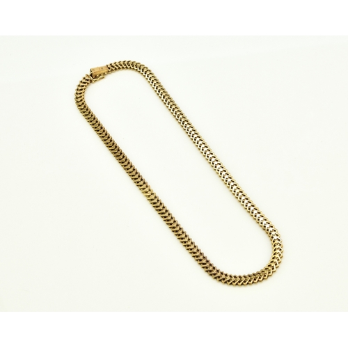 35 - A 14ct yellow gold decorative link necklace, the stylised interlocking openwork square links with in... 