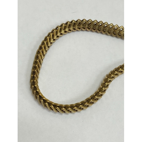 35 - A 14ct yellow gold decorative link necklace, the stylised interlocking openwork square links with in... 