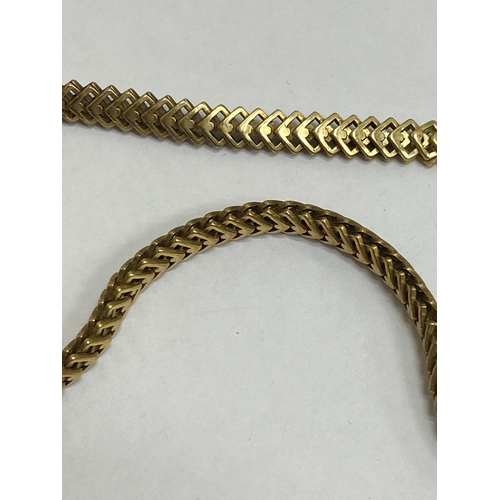 35 - A 14ct yellow gold decorative link necklace, the stylised interlocking openwork square links with in... 