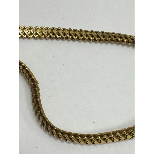 35 - A 14ct yellow gold decorative link necklace, the stylised interlocking openwork square links with in... 