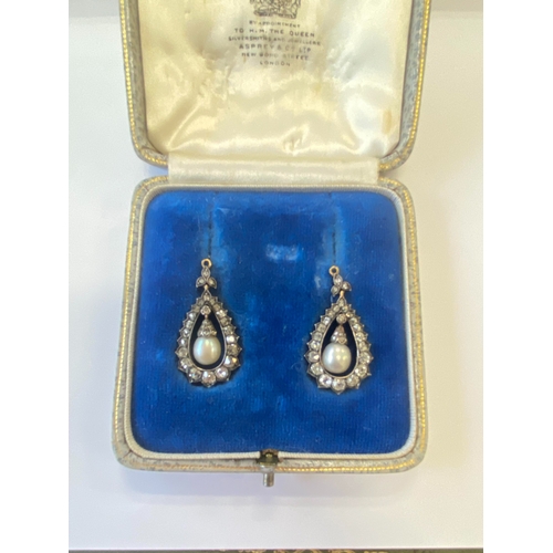 36 - A pair of late 19th century diamond and untested pearl ear pendants, each designed as a central pear... 