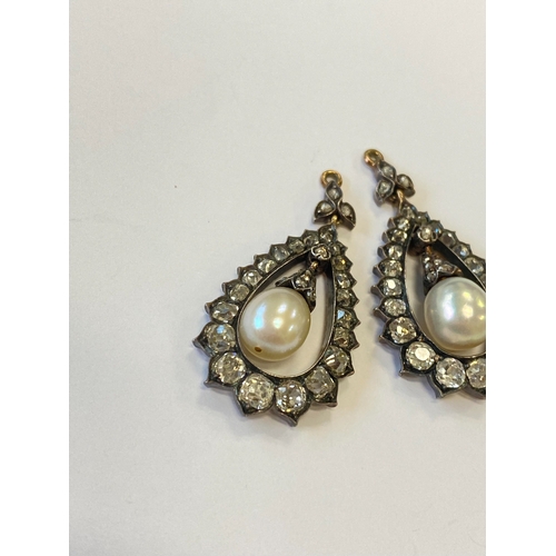 36 - A pair of late 19th century diamond and untested pearl ear pendants, each designed as a central pear... 