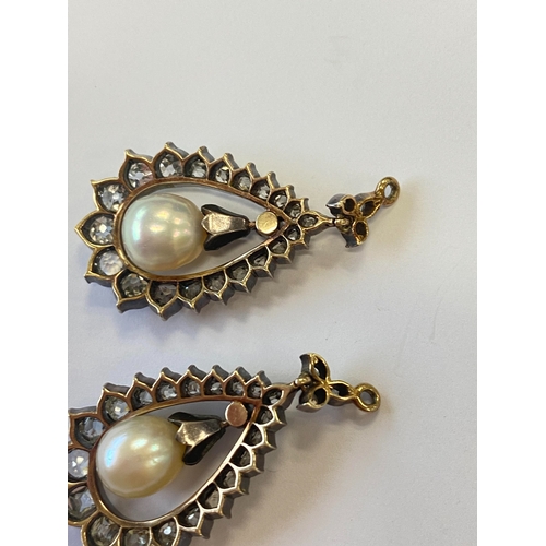 36 - A pair of late 19th century diamond and untested pearl ear pendants, each designed as a central pear... 