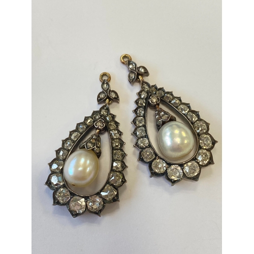 36 - A pair of late 19th century diamond and untested pearl ear pendants, each designed as a central pear... 