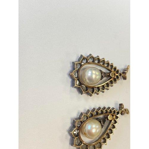 36 - A pair of late 19th century diamond and untested pearl ear pendants, each designed as a central pear... 