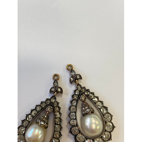 36 - A pair of late 19th century diamond and untested pearl ear pendants, each designed as a central pear... 