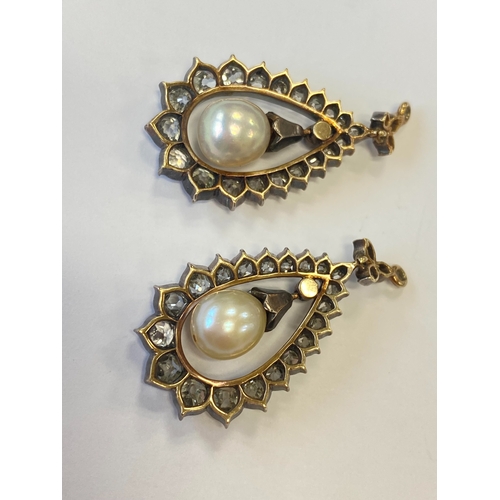 36 - A pair of late 19th century diamond and untested pearl ear pendants, each designed as a central pear... 
