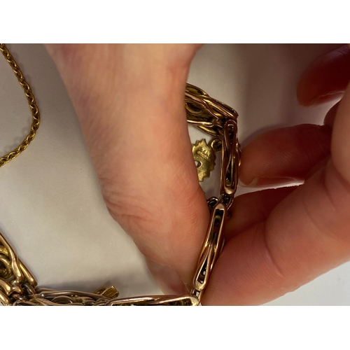 40 - A rose metal decorative link bracelet with attached charms, the rose metal bracelet with integral cl... 