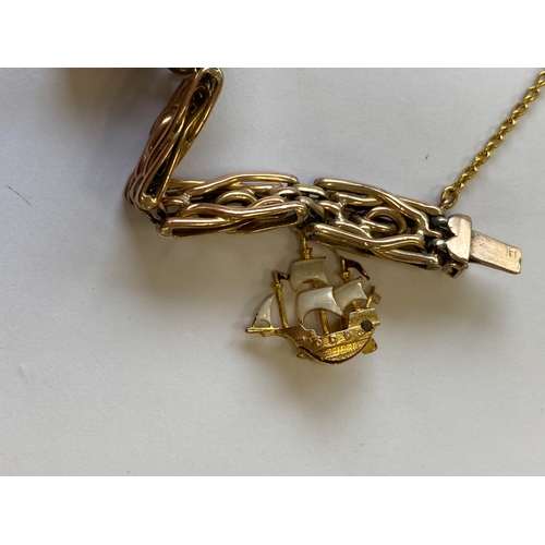 40 - A rose metal decorative link bracelet with attached charms, the rose metal bracelet with integral cl... 