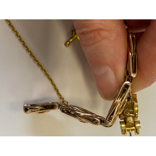 40 - A rose metal decorative link bracelet with attached charms, the rose metal bracelet with integral cl... 