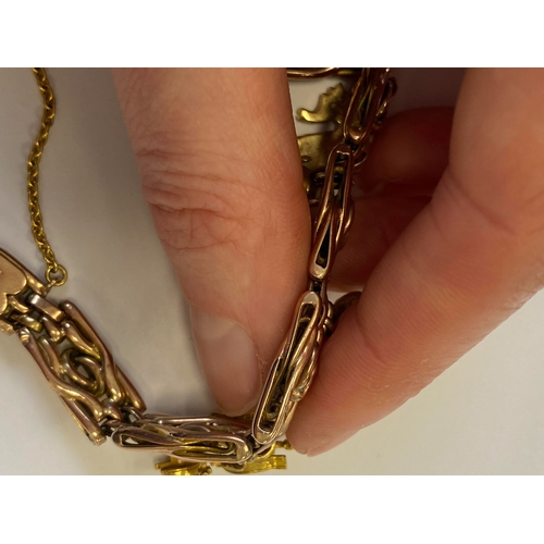 40 - A rose metal decorative link bracelet with attached charms, the rose metal bracelet with integral cl... 