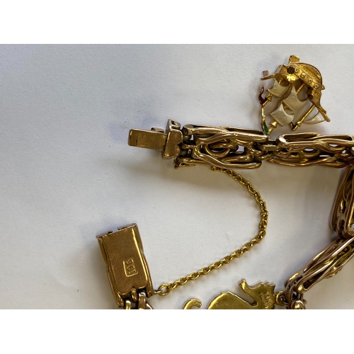 40 - A rose metal decorative link bracelet with attached charms, the rose metal bracelet with integral cl... 