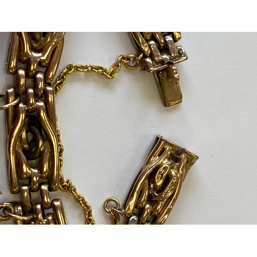 40 - A rose metal decorative link bracelet with attached charms, the rose metal bracelet with integral cl... 