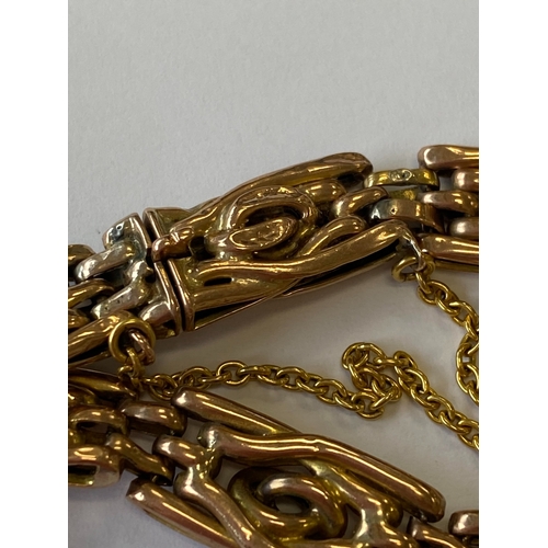 40 - A rose metal decorative link bracelet with attached charms, the rose metal bracelet with integral cl... 