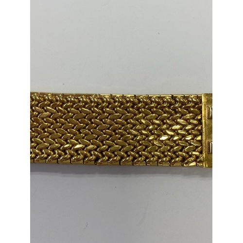 42 - A French yellow metal bracelet, the polished and textured integral links of stylised leaf design, wi... 