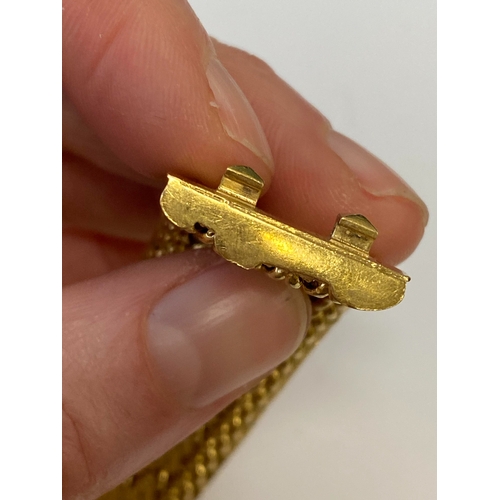 42 - A French yellow metal bracelet, the polished and textured integral links of stylised leaf design, wi... 