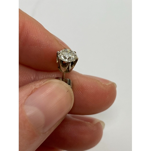 43 - A pair of diamond stud earrings, the brilliant cut diamonds claw set in white metal with post fittin... 