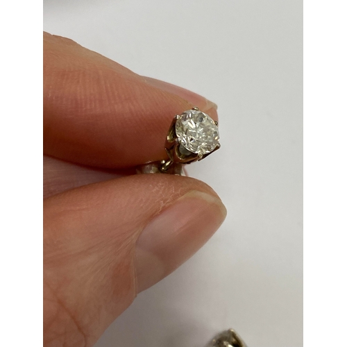 43 - A pair of diamond stud earrings, the brilliant cut diamonds claw set in white metal with post fittin... 