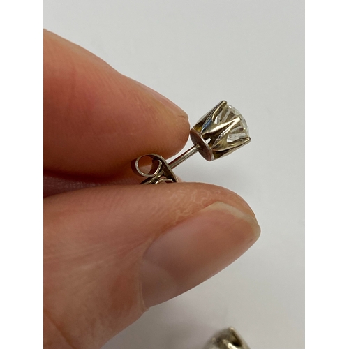 43 - A pair of diamond stud earrings, the brilliant cut diamonds claw set in white metal with post fittin... 