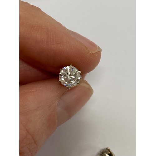 43 - A pair of diamond stud earrings, the brilliant cut diamonds claw set in white metal with post fittin... 