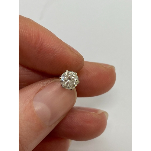 43 - A pair of diamond stud earrings, the brilliant cut diamonds claw set in white metal with post fittin... 