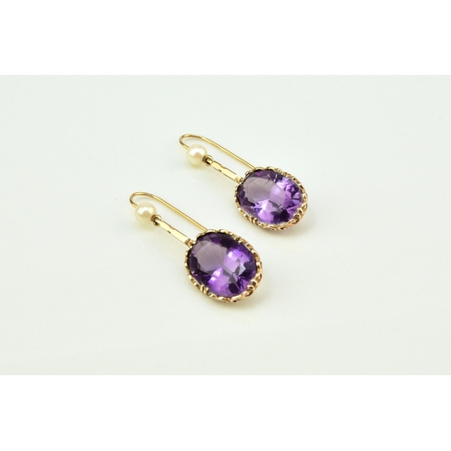 44 - A pair of 9ct gold amethyst and cultured pearl ear pendants, each designed as a single oval mixed cu... 