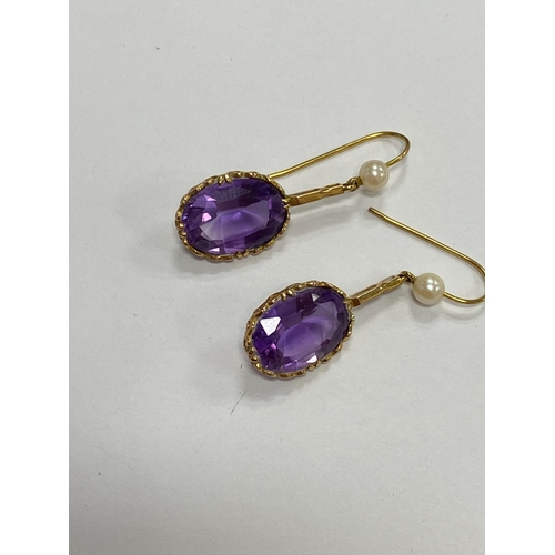 44 - A pair of 9ct gold amethyst and cultured pearl ear pendants, each designed as a single oval mixed cu... 