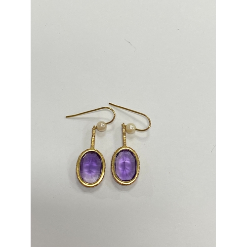 44 - A pair of 9ct gold amethyst and cultured pearl ear pendants, each designed as a single oval mixed cu... 
