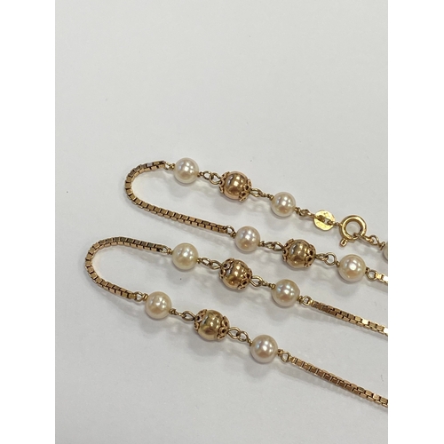 46 - A 9ct gold cultured pearl set necklace, the 9ct gold box link chain set with eleven polished gold be... 