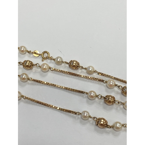 46 - A 9ct gold cultured pearl set necklace, the 9ct gold box link chain set with eleven polished gold be... 