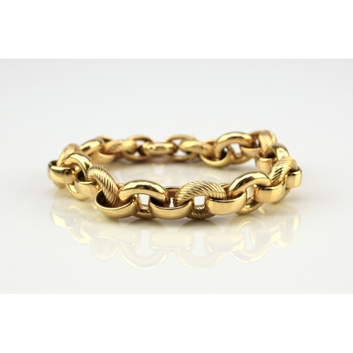 47 - An Italian 18ct yellow gold bracelet, formed of alternating textured and polished hollow circular li... 
