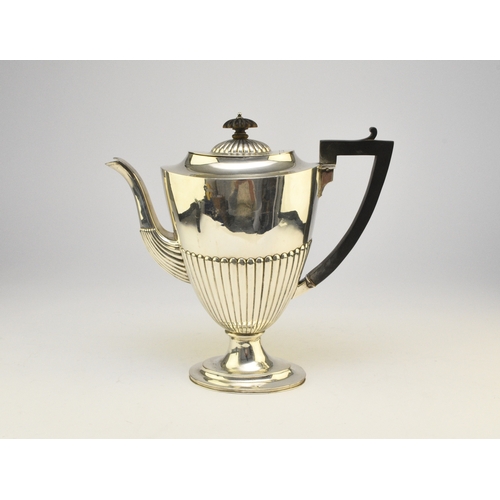 6 - A Victorian silver coffee pot, makers mark rubbed, London 1890, of pedestal half reeded form with eb... 