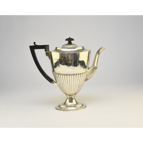 6 - A Victorian silver coffee pot, makers mark rubbed, London 1890, of pedestal half reeded form with eb... 
