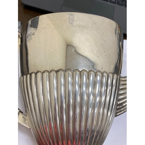 6 - A Victorian silver coffee pot, makers mark rubbed, London 1890, of pedestal half reeded form with eb... 