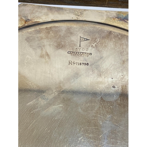 8 - An Art Deco silver salver, Walker & Hall Sheffield 1933, of octagonal form with decorative reed and ... 