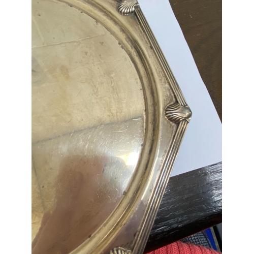 8 - An Art Deco silver salver, Walker & Hall Sheffield 1933, of octagonal form with decorative reed and ... 