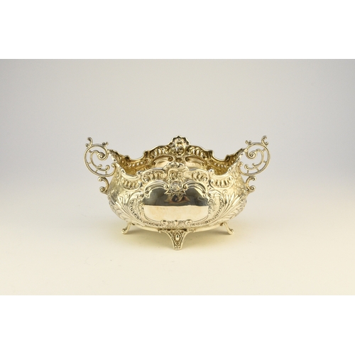 9 - A Victorian silver two handled dish, Albert Henry Thompson, Sheffield 1899, of oval form with emboss... 
