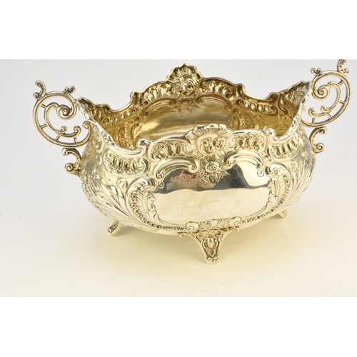 9 - A Victorian silver two handled dish, Albert Henry Thompson, Sheffield 1899, of oval form with emboss... 