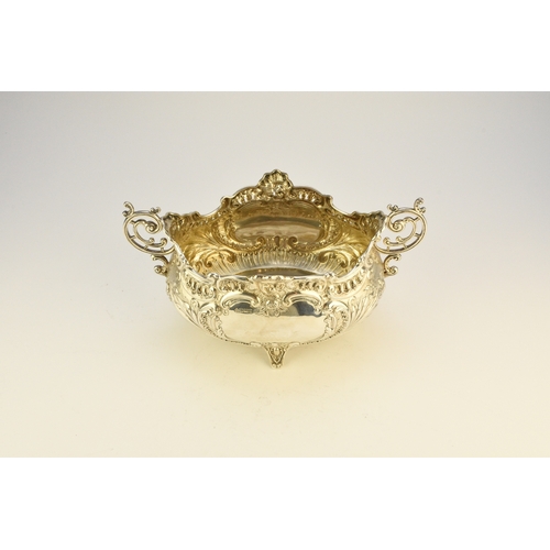 9 - A Victorian silver two handled dish, Albert Henry Thompson, Sheffield 1899, of oval form with emboss... 